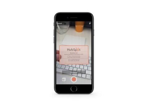Screenshot of Hubspot's business card scanner, available on the HubSpot app;  What is AI?